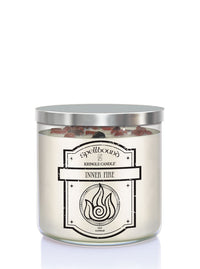 Spellbound Inner Fire candle with silver lid on a white background showing front of candle 