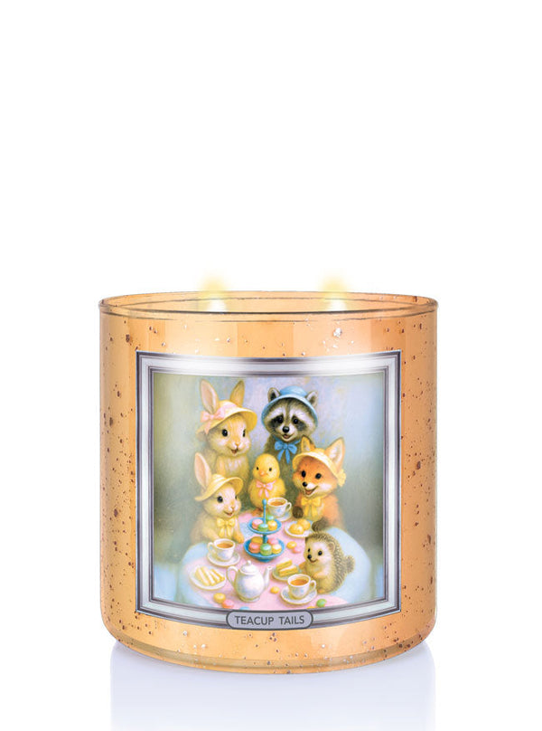 Decorative candle with animal illustrations and 'Teacup Tails' text on a white background