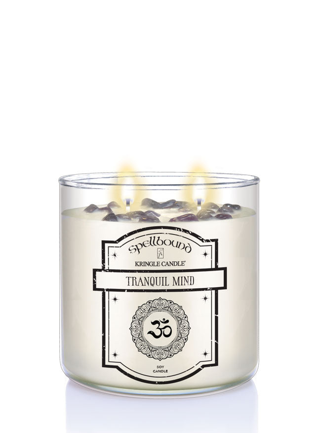 Lit Candle with 'Spellbound' label and 'Tranquil Mind' text on a white background