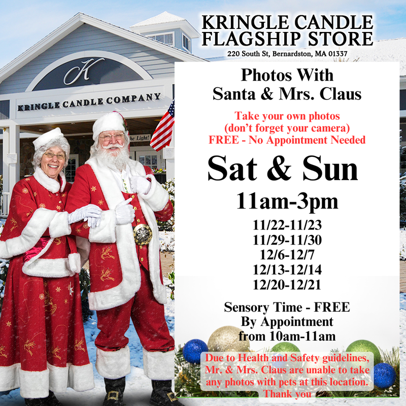 Santa and Mrs. Claus smiling in front of the Kringle Candle Flagship Store decorated for the holidays with snow and festive garlands. Text on the image announces free photos with Santa and Mrs. Claus every Saturday and Sunday from 11am–3pm, with sensory time by appointment from 10am–11am.