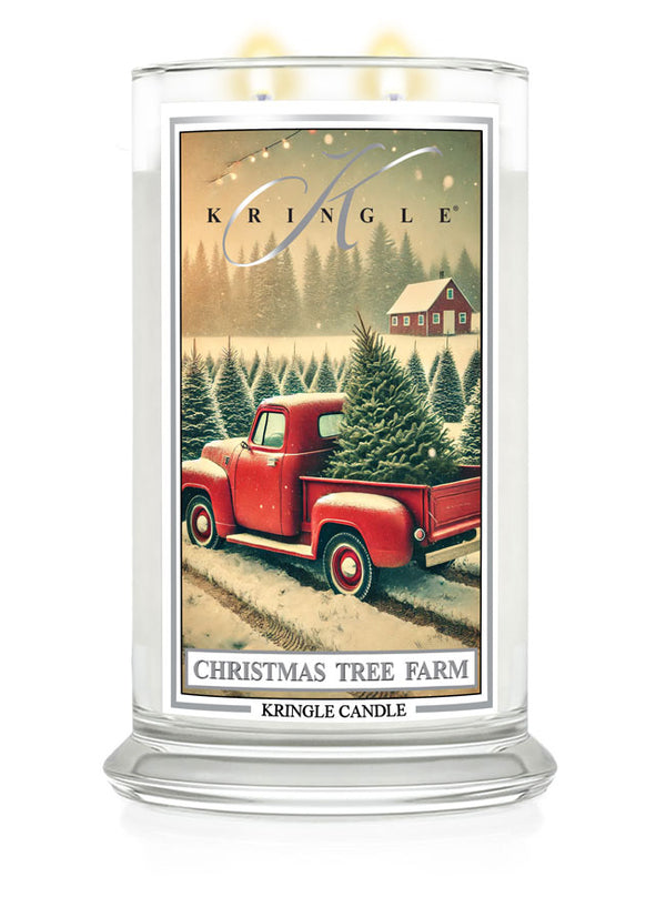 Red truck with Christmas trees on a snowy farm, Kringle Candle "Christmas Tree Farm" large jar.