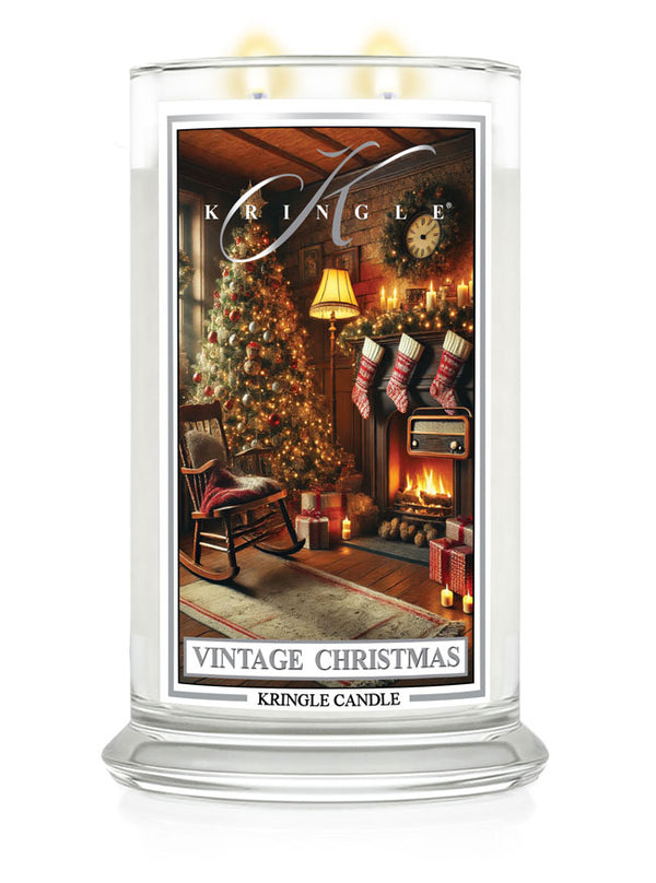 Kringle Candle Vintage Christmas large jar featuring a cozy holiday scene with a decorated tree and stockings by the fireplace.