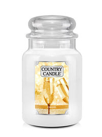 White candle in a glass jar with 'Country Candle Cheers' label on a white background