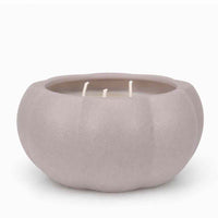 A three-wick candle in a matte, rounded pumpkin-shaped container with a light taupe-gray color, set against a plain white background.
