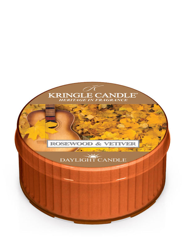 Unlit DayLight candle in "Rosewood & Vetiver" scent. Label shows a guitar and autumn leaves.