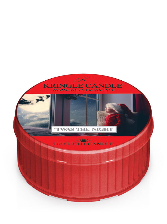 Red Kringle Candle daylight candle with a festive design on the lid.