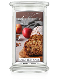 Unlit Apple Rum Cake 2-Wick candle. Label shows apple rum cake slices on a board with apples in the background.