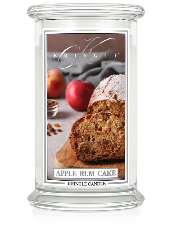 Unlit Apple Rum Cake 2-Wick candle. Label shows apple rum cake slices on a board with apples in the background.