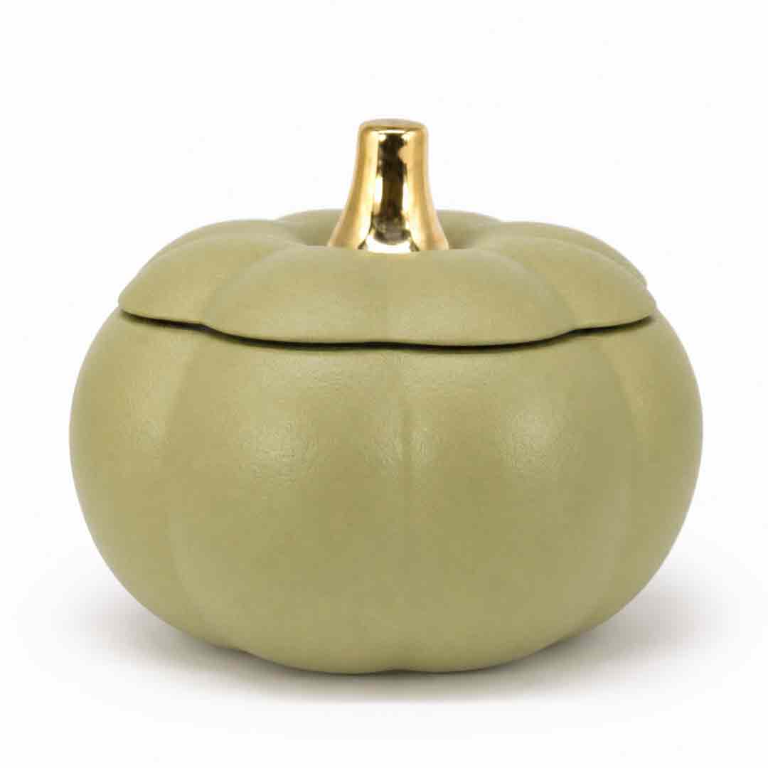 A small pumpkin-shaped lidded container in a muted sage green color with a shiny gold metallic stem, set against a plain white background.