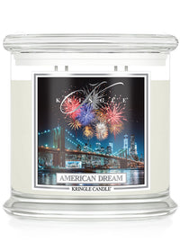 Kringle Candle 'American Dream' with fireworks and cityscape design on a white background