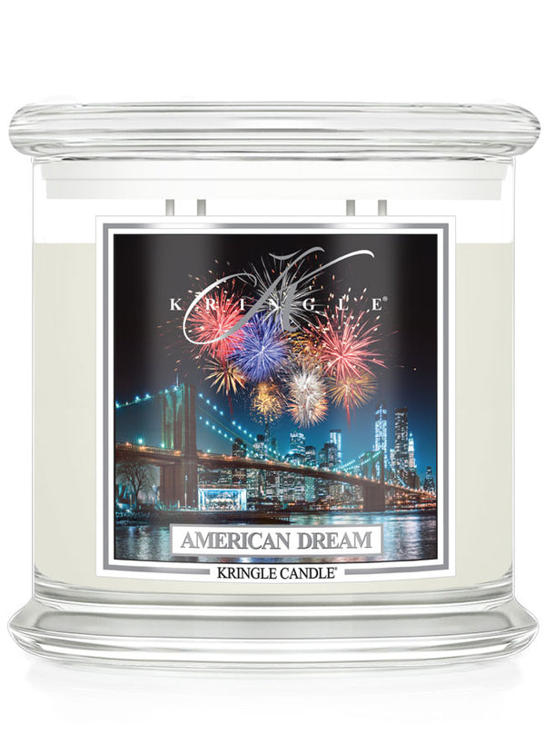 Kringle Candle 'American Dream' with fireworks and cityscape design on a white background