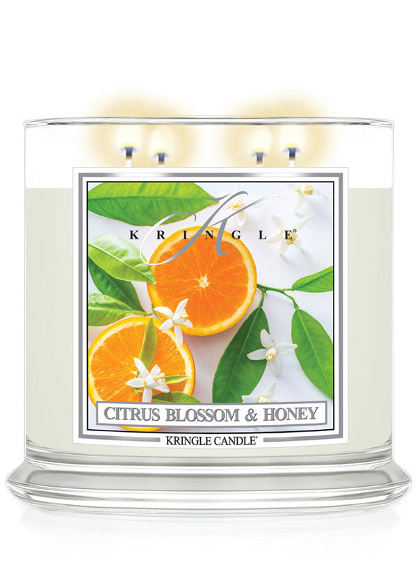 Kringle Candle with Citrus Blossom & Honey label featuring oranges and leaves on a white background