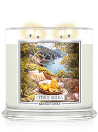 Kringle Candle Citrus Solea 4-wick candle with scenic design on a white background