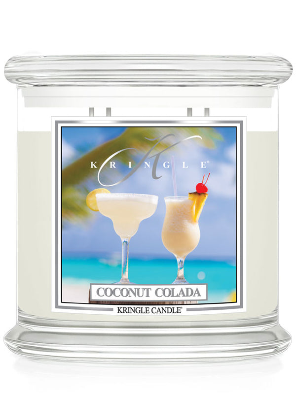 Kringle Candle Coconut Colada scented candle with a tropical design on the label.