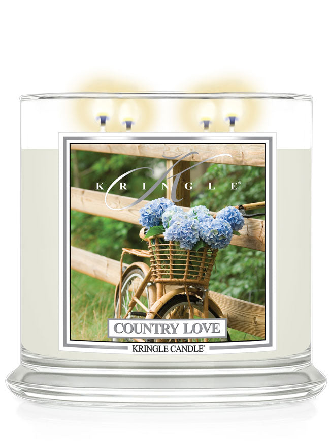 Kringle Candle with 'Country Love' packaging featuring a bicycle and flowers.