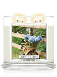 Kringle Candle with 'Country Love' packaging featuring a bicycle and flowers.