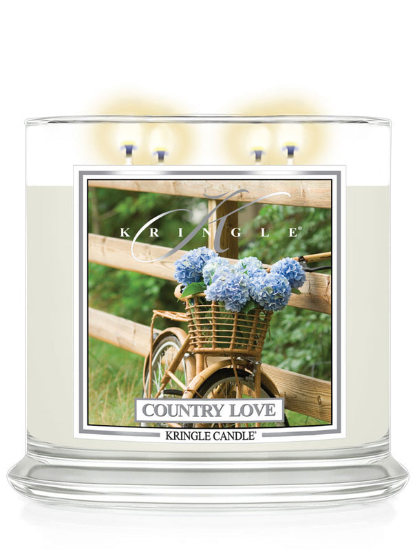 Kringle Candle with 'Country Love' packaging featuring a bicycle and flowers.