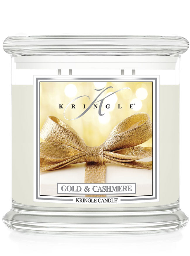 Kringle Candle with gold bow design on a white background