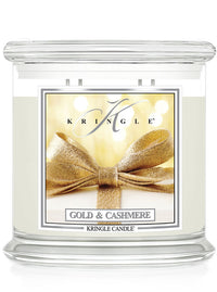 Kringle Candle with gold bow design on a white background