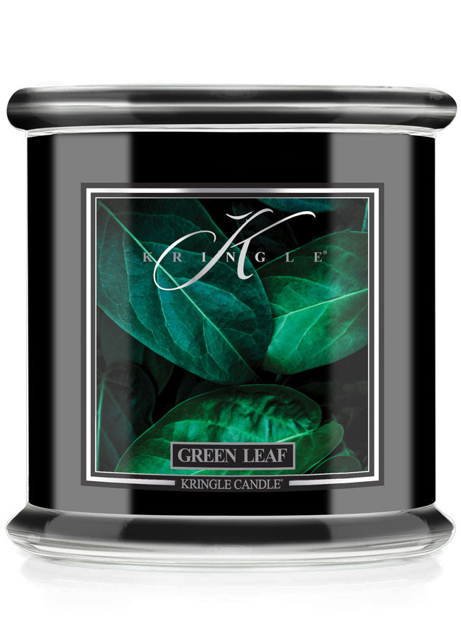 Kringle Candle with green leaf design on a white background