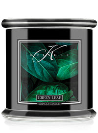 Kringle Candle with green leaf design on a white background