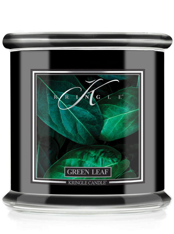 Kringle Candle with green leaf design on a white background
