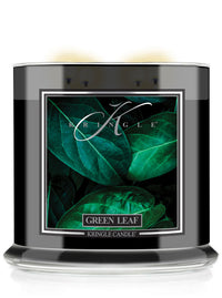 Kringle Candle with green leaf design on a white background