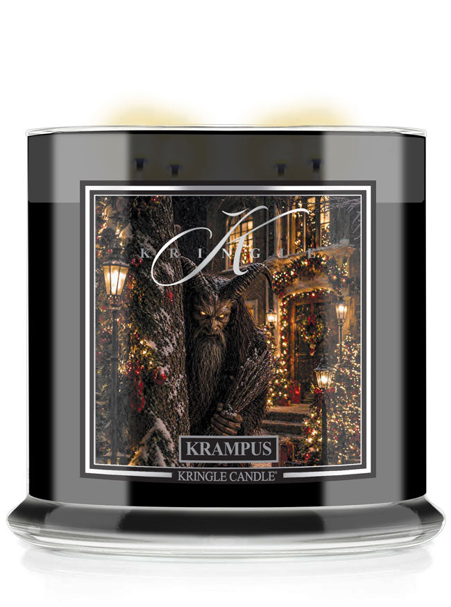 A Krampus Halloween Kringle Candle in a black glass jar, featuring a festive label of a horned creature in a decorated Christmas village scene.