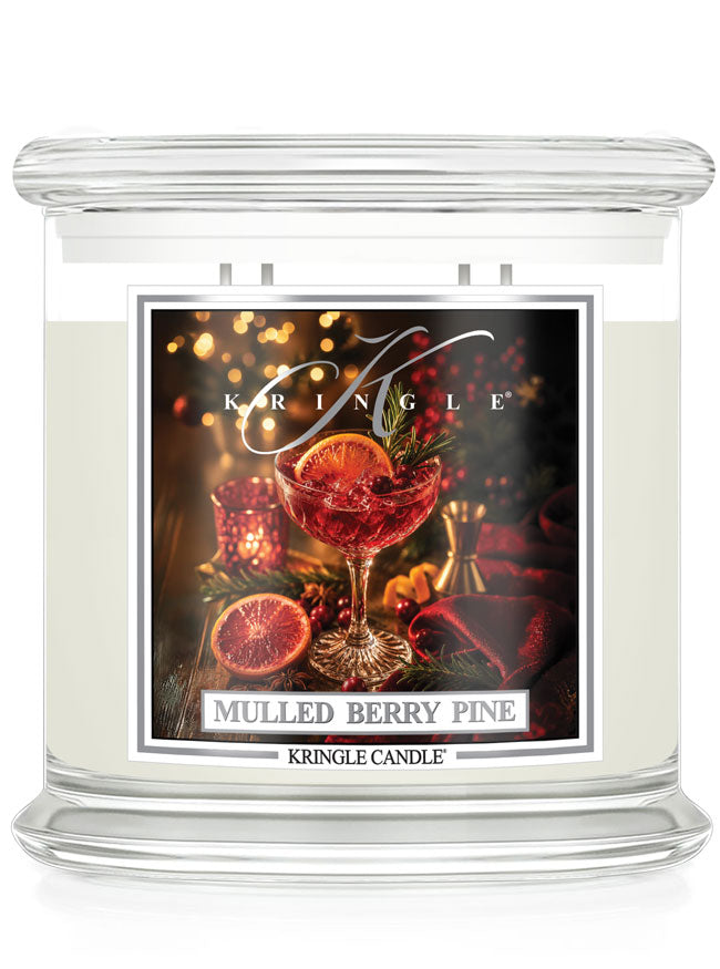 Mulled Berry Pine 4-wick candle by Kringle Candle with a label featuring a wine glass with a green sprig, berries and orange slice.