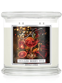 Mulled Berry Pine 4-wick candle by Kringle Candle with a label featuring a wine glass with a green sprig, berries and orange slice.