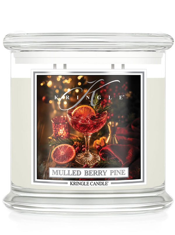 Mulled Berry Pine 4-wick candle by Kringle Candle with a label featuring a wine glass with a green sprig, berries and orange slice.