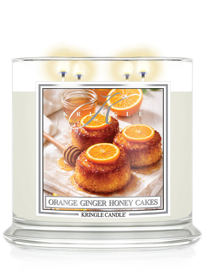 Kringle Candle with an orange ginger honey cakes design on a white background