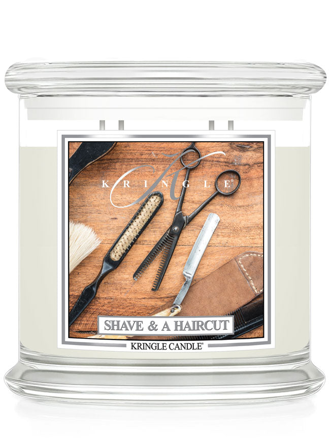 Kringle Candle with 'Shave & A Haircut' design on a wooden background