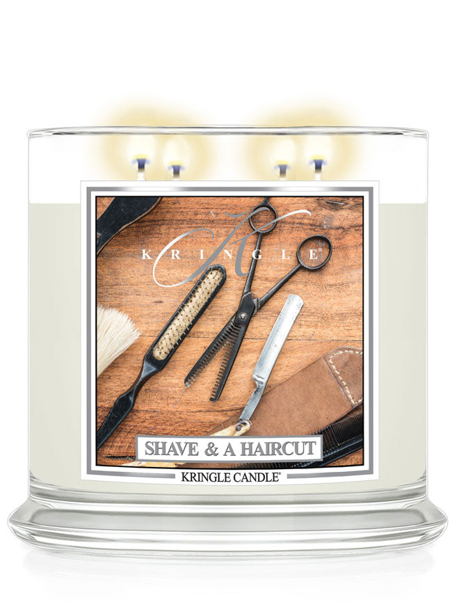 Kringle Candle with 'Shave & A Haircut' design featuring barber tools on a wooden background.