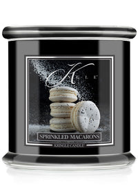 Kringle Candle with 'Sprinkled Macarons' design on a black background
