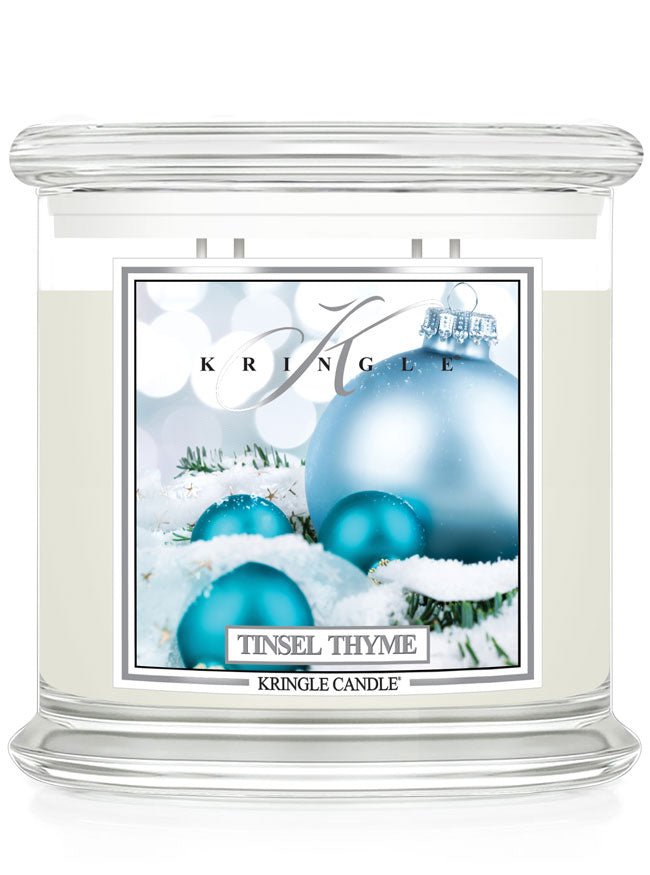 Kringle Candle Tinsel Thyme candle with decorative label on a white background