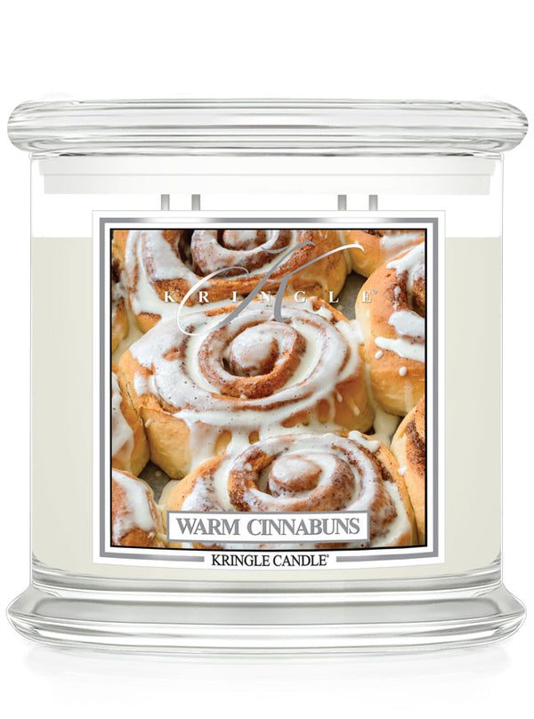 Kringle Candle Warm Cinnabuns 4-wick candle with a design of cinnamon buns on a white background