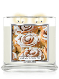 Kringle Candle Warm Cinnabuns 4-wick candle with 'Warm Cinnabuns' packaging on a white background