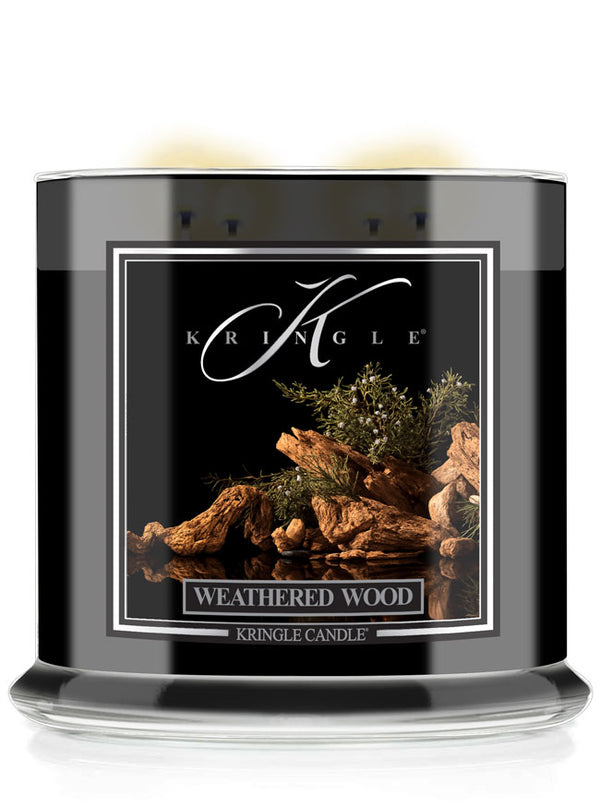 Kringle Candle 4-wick Weathered Wood candle with black label.