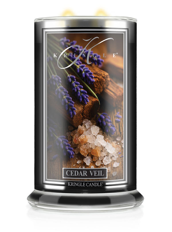 Kringle Candle Cedar Veil candle with lavender and wood design on the packaging.