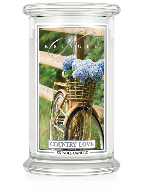 Kringle Candle with bicycle and flowers design on a white background
