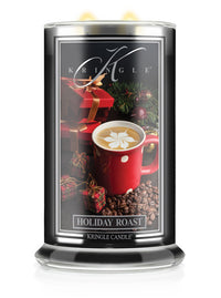 Kringle Candle with holiday design featuring a red mug and gift box on a black background.