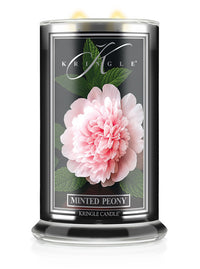 Kringle Candle Minted Peony lit candle with pink peony flower design on a white background