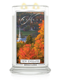 Kringle Candle with New England scene on a white background