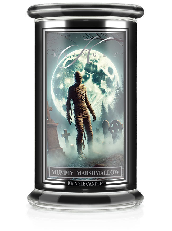 Unlit Halloween "Mummy Marshmallow" candle jar. Label shows a mummy walking in a moonlit graveyard.