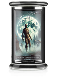 Unlit Halloween "Mummy Marshmallow" candle jar. Label shows a mummy walking in a moonlit graveyard.
