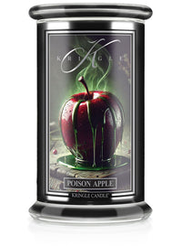 Unlit Halloween candle in "Poison Apple" scent with a label showing a glossy apple covered in green liquid.