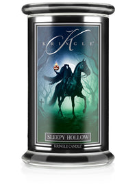 Unlit Halloween "Sleepy Hollow" candle jar. Label shows a headless horseman holding a jack-o'-lantern in a spooky forest.