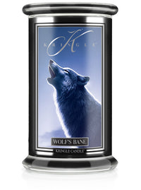 Unlit Halloween candle labeled "Wolf's Bane" with an image of a howling wolf under a blue sky.