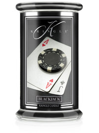 Jar candle of "Black Jack" unlit. Label shows a poker chip on ace of hearts and jack of clubs cards.